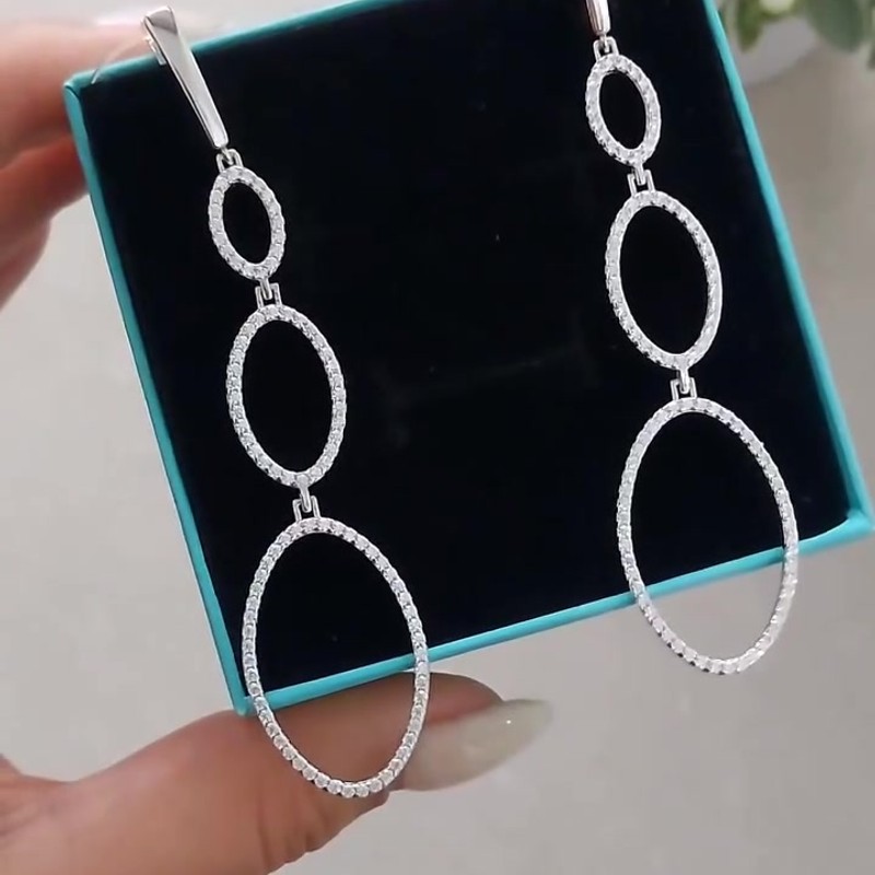 Серебряные длинные серьги 925 пробы с тремя овалами и фианитами из серебро